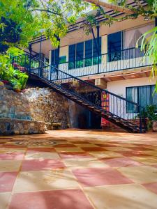 a staircase in front of a building with a building at EcoHotel Brisas del Amani in Norcasia