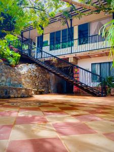 a staircase in front of a building with a building at EcoHotel Brisas del Amani in Norcasia +25 photos