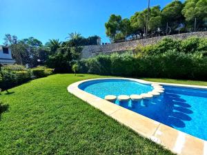 a swimming pool with lounge chairs in a yard at Altea Old Town Paraiso in Altea