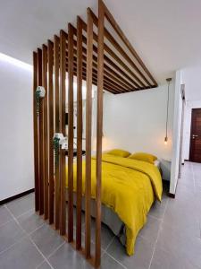 Krevet ili kreveti u jedinici u objektu Coconut Room - Entre mer et forêt avec piscine