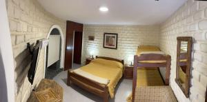 a bedroom with two bunk beds in a room at HOTEL CAASAMA in Santa María +36 photos