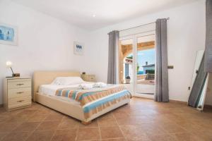 Łóżko lub łóżka w pokoju w obiekcie Villa Noa - PlusHolidays