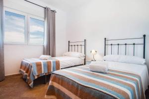 Łóżko lub łóżka w pokoju w obiekcie Villa Noa - PlusHolidays
