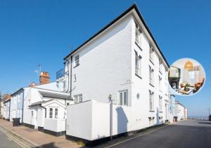 a white building on the side of a street at Barley Rise in Southwold
