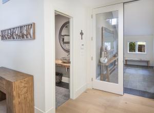 a hallway with a door leading to a dining room at Welcome to the Modern Mountain Luxury! home in Avon