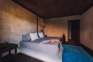 Postel nebo postele na pokoji v ubytování Radhoo Tulum