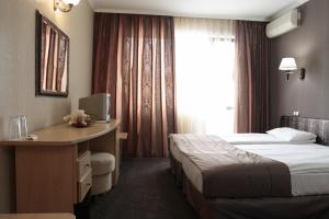 Postel nebo postele na pokoji v ubytování Guest House Palazzo