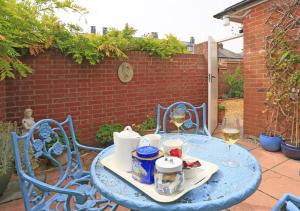 a blue table with a tray of food and drinks on it at Little Doric in Woodbridge