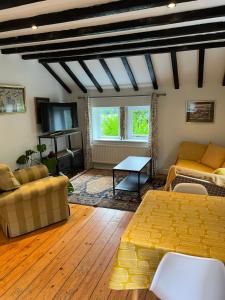 a living room with a couch and a table at Walkers paradise on the Pennine way Charlestown in Halifax