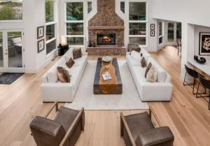 a living room with a couch and a fireplace at Modern Beaver Creek Private House! in Avon