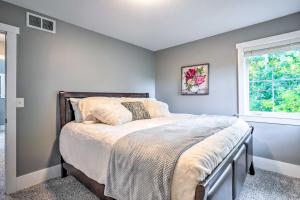 a bedroom with a bed and a window at Pet-Friendly Minneapolis Home about 6 Mi to Dtwn! in Minneapolis