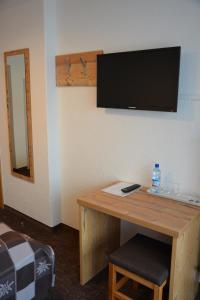 Televízia a/alebo spoločenská miestnosť v ubytovaní Senner Appartements