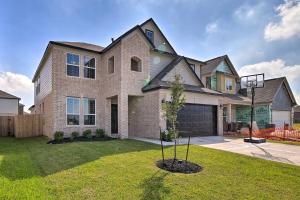 a large brick house with a tree in the yard at Houston Home with Private Yard - 16 Mi to Dtwn in Houston