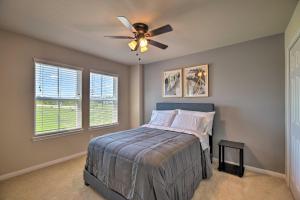 a bedroom with a bed and a ceiling fan at Houston Home with Private Yard - 16 Mi to Dtwn in Houston