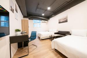 Postel nebo postele na pokoji v ubytování HotelsHere - Ximen