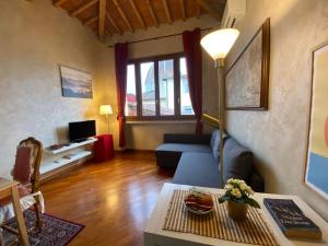 a living room with a couch and a table at Cozy CENTRAL apartment in Florence - spectacular views of Duomo in Florence