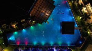 una vista aérea de una piscina por la noche en Chivatara Resort Bang Tao Beach Phuket - SHA en Bang Tao Beach