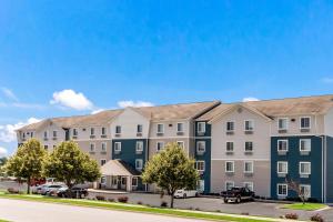 a rendering of a apartment building with cars parked outside at Extended Stay America Select Suites - Fayetteville - Fort Bragg in Fayetteville