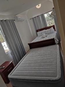 Кровать или кровати в номере Samana house