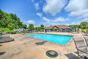 a swimming pool with chairs and a building at Morganton Tiny Home Less Than 5 Mi to Blue Ridge Lake in Morganton