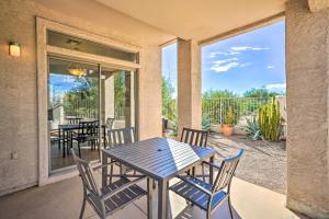 a patio with a table and chairs on a porch at Cave Creek Retreat with Private Pool and Hot Tub! in Cave Creek