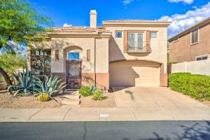 a house with a garage and a driveway at Cave Creek Retreat with Private Pool and Hot Tub! in Cave Creek