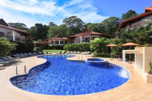 a swimming pool in the middle of a resort at Terrazas del Caribe Hotel in Puerto Viejo