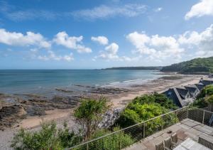 a view of the beach from a balcony at Sunridge in Amroth