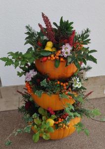 a display of a flower arrangement in a pumpkin at Ferienwohnung/ Ferienresidenze Manuela in Obertrubach