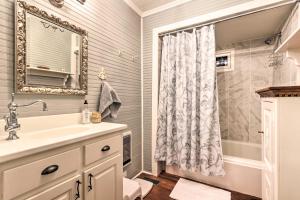 a bathroom with a sink and a shower with a mirror at Waterfront Home with Boat Dock on Mirror Lake! in Highlands +19 photos