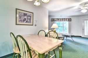 een eetkamer met een houten tafel en stoelen bij Sand Point Apartment with Proximity to Beaches! in Pigeon