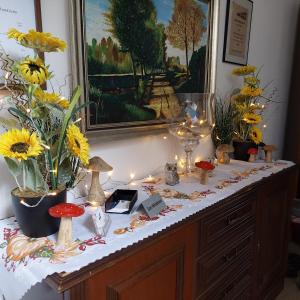 a table with flowers and candles on top of it at Ferienwohnung/ Ferienresidenze Manuela in Obertrubach
