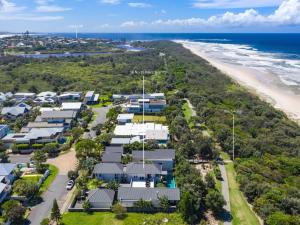 an aerial view of a resort with the beach at Beachfront On Northpoint in Kingscliff