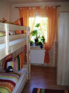a bedroom with two bunk beds and a window at Zeche 33 in Kurort Oberwiesenthal