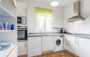 a white kitchen with a washing machine in it at 3 Bedroom Gorgeous Home In Malaga in Málaga