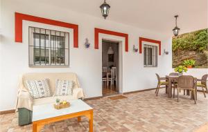 a living room with a couch and a table at 3 Bedroom Gorgeous Home In Malaga in Málaga