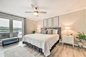 a bedroom with a bed and a large window at Lakefront Sherrills Ford Haven with Boat Dock! in Denver