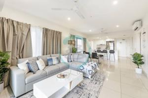 a living room with a couch and a table at ZEN OCEAN BLISS - Cozy 2-BR/2-BA Sea View Retreat in Darwin