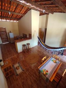 an aerial view of a room with a hammock in a house at Alameda dos Coqueirais in Icaraí