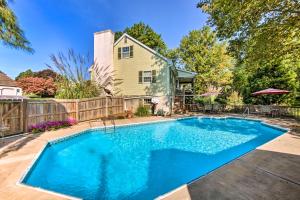 a swimming pool in the backyard of a house at New Holland Apartment with Patio, Deck and Pool in New Holland