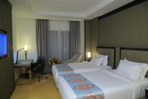 Postel nebo postele na pokoji v ubytování Check Inn Hotel Addis Ababa