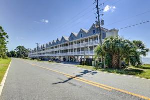 a large building on the side of a road at Carrabelle Condo Beach and Fishing Pier Access in Big Blackjack Landing