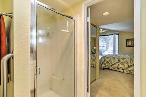 a walk in shower in a room with a bedroom at Cathedral City Golf Course Condo with Patio in Cathedral City