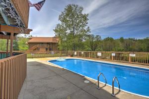 a swimming pool in front of a house at Bellaire Home with Golf Course View and Pool Access! in Bellaire