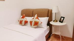 Łóżko lub łóżka w pokoju w obiekcie 16 Forest City homestay-free WIFI-森林城市民宿