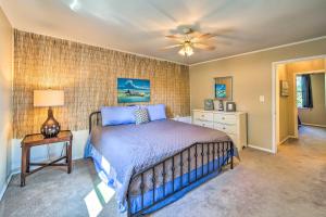a bedroom with a bed and a ceiling fan at Mountainburg Apt Less Than 5 Mi to Lake Fort Smith! in Chester