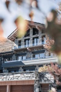 a building with balconies on top of it at Chalet Ancolie in Tignes