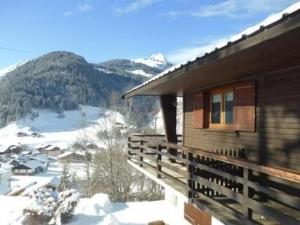 a log cabin with a view of a snow covered mountain at Chalet Arêches-Beaufort, 4 pièces, 7 personnes - FR-1-342-234 in Beaufort