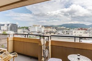 a balcony with a view of a city at Residence Ferie Nara station in Nara