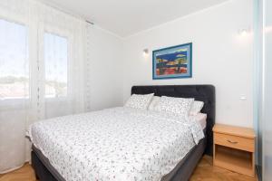 Postel nebo postele na pokoji v ubytování Apartment Mara